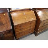 An Edwardian mahogany bureau, fitted four graduated drawers, on bracket feet, 29 1/2" wide