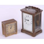 An early 20th century brass cased carriage clock and a brass cased travelling alarm clock