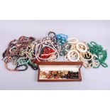 A collection of bead necklaces, including jade, other hardstones, bone, etc and various vintage clip