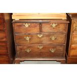 A Georgian mahogany chest of two short and two long graduated drawers, on bracket feet, 32" wide x