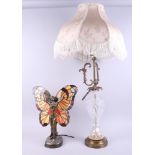 A "Tiffany" style table lamp, in the form of a fairy dancing, the wings formed from multi-coloured