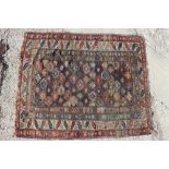 An antique Caucasian rug with all-over star and hooked gul design to centre and multi stripe