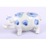 A Chinese blue and white model of a pig with character marks to belly