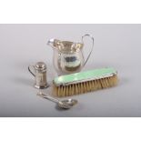 An enamel on silver brush, a cream jug, a pepper pot and a spoon, 4.8oz troy weighable