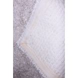 A cream wool rug, 124" x 98" approx