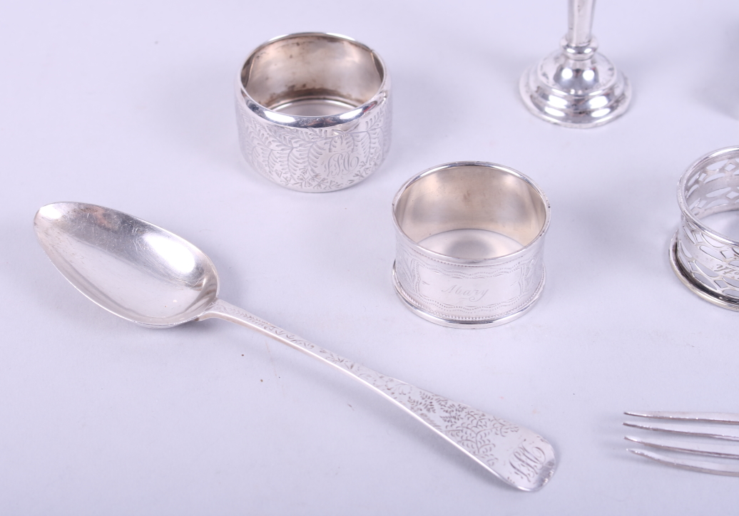 Two silver napkin rings, a silver fork, a silver spoon, a silver match box sleeve, a miniature - Image 2 of 4