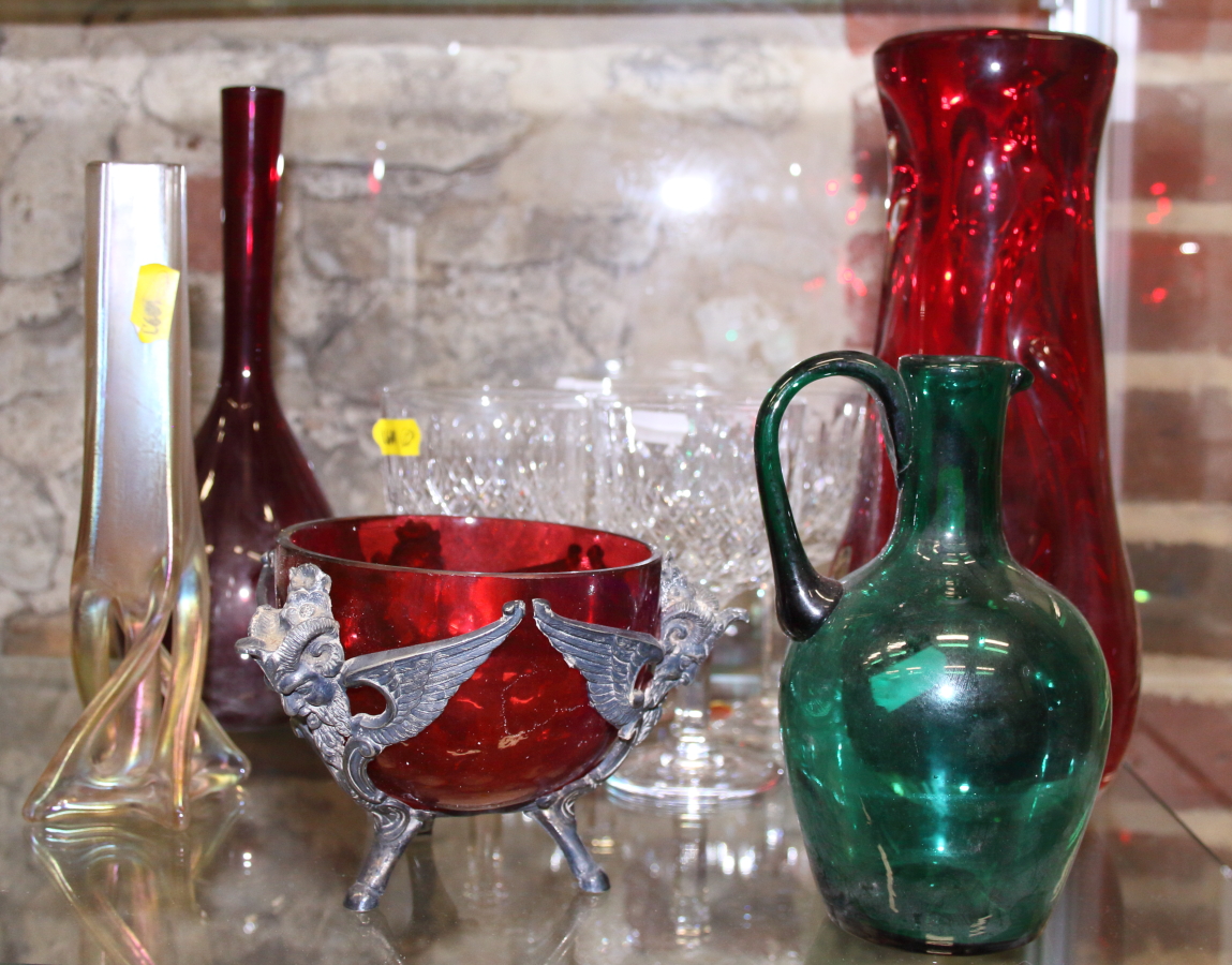 Four cut glass white wine glasses, a ruby glass sprinkler bottle, a jug, a ruby glass vase and other