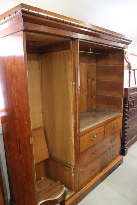 A late 19th century Wellingtonia pine wardrobe, the interior fitted chest of two short and two