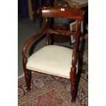 A William IV mahogany low carver chair, on fluted supports
