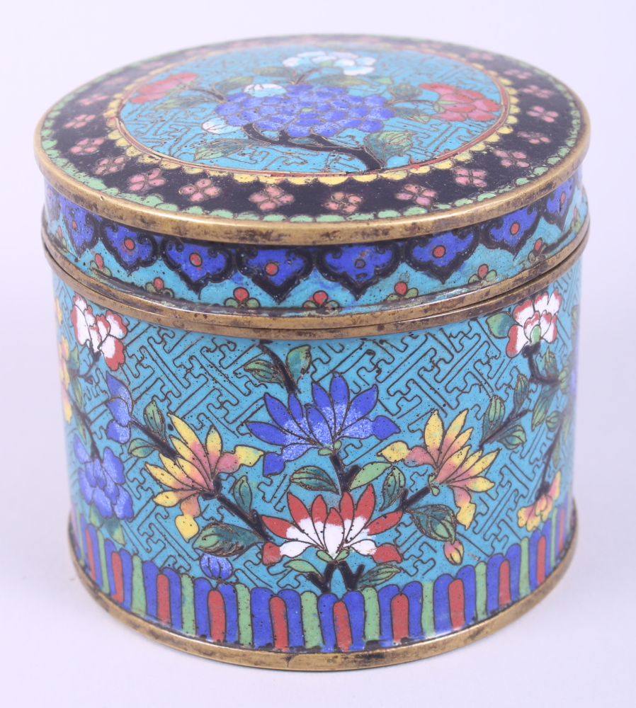 A 19th century cloisonne circular box and cover, decorated flowers, 3 3/4" high