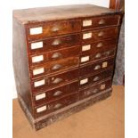 A pine chest of fourteen short graduated drawers, on block base, 44" wide