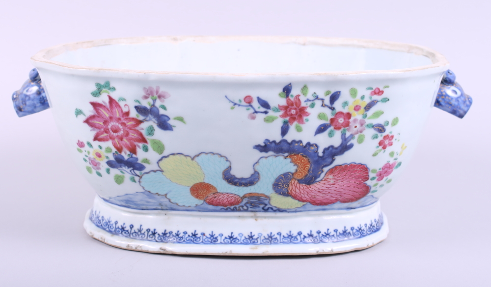 A Chinese tureen base, decorated flowers with dragon face handle, 13 3/4" wide
