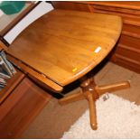 A modern drop flap kitchen table on turned column and a pair of matching kitchen chairs