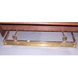 An Art Nouveau design brass fender curb, 48" wide