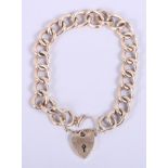 A yellow metal curb link bracelet with 9ct gold heart-shaped clasp, 11.7g
