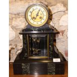 A 19th century slate and green marble clock with hanging pendulum, 15 1/2" high