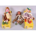 Two standard Pelham puppets, "Mitzi" and "Gretel", in boxes, and another puppet, unboxed