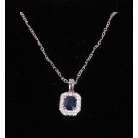 An 18ct white gold pendant mounted sapphire and diamond accents, on 18ct white gold fine chain