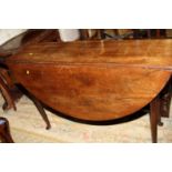 A late 19th century mahogany drop leaf table, on taper supports with pad feet, 48" wide