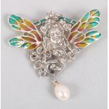 A white metal and plique a jour brooch/pendant mounted pearl drop, in the form of a fairy's head and