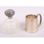 A silver christening mug, 2.9oz troy approx, and a silver topped scent bottle