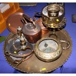 A Middle Eastern brass tray, two copper kettles, two copper trays, a brass stand, a letter opener