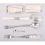 A Mappin & Webb silver preserve spoon, a pair of silver card cases, a silver pill box, a silver