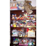 A collection of puppets and toy figures, including Noddy, Disney, the Simpsons and others, boxed and