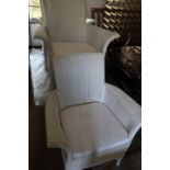 Three modern white Lloyd Loom armchairs
