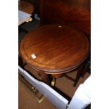 A mahogany circular two-tier occasional table, on square taper supports, 23" dia
