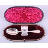 A silver two-piece matched christening napkin ring and spoon set, 1.5oz troy approx, in case