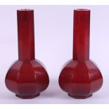 A matched pair of Peking red glass sprinkler bottles, 7 1/2" high