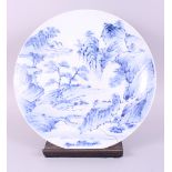 A Chinese blue and white shallow dish, decorated landscape with hills and trees, 14 3/4" dia (