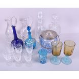 Two cut glass decanters and stoppers, two cut glass claret jugs, two George Sand type coloured glass