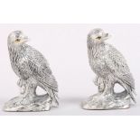 A pair of silver plated salt and pepper shakers, in the form of birds of prey, 2 1/2" high