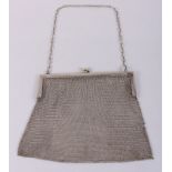 A white metal chain work evening bag