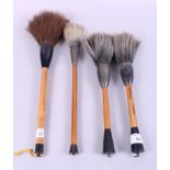 Four Japanese calligraphy brushes with bamboo handles