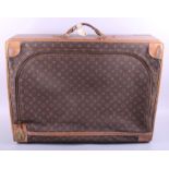 A Louis Vuitton leather front opening suitcase with carry handle, 28 1/2" wide