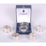 A cased pair of silver napkin rings and four others, 6.3oz troy approx