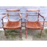 A pair of mahogany rope back carver chairs, on turned supports