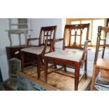 Six mahogany dining chairs with floral tapestry seats, on square tapered supports