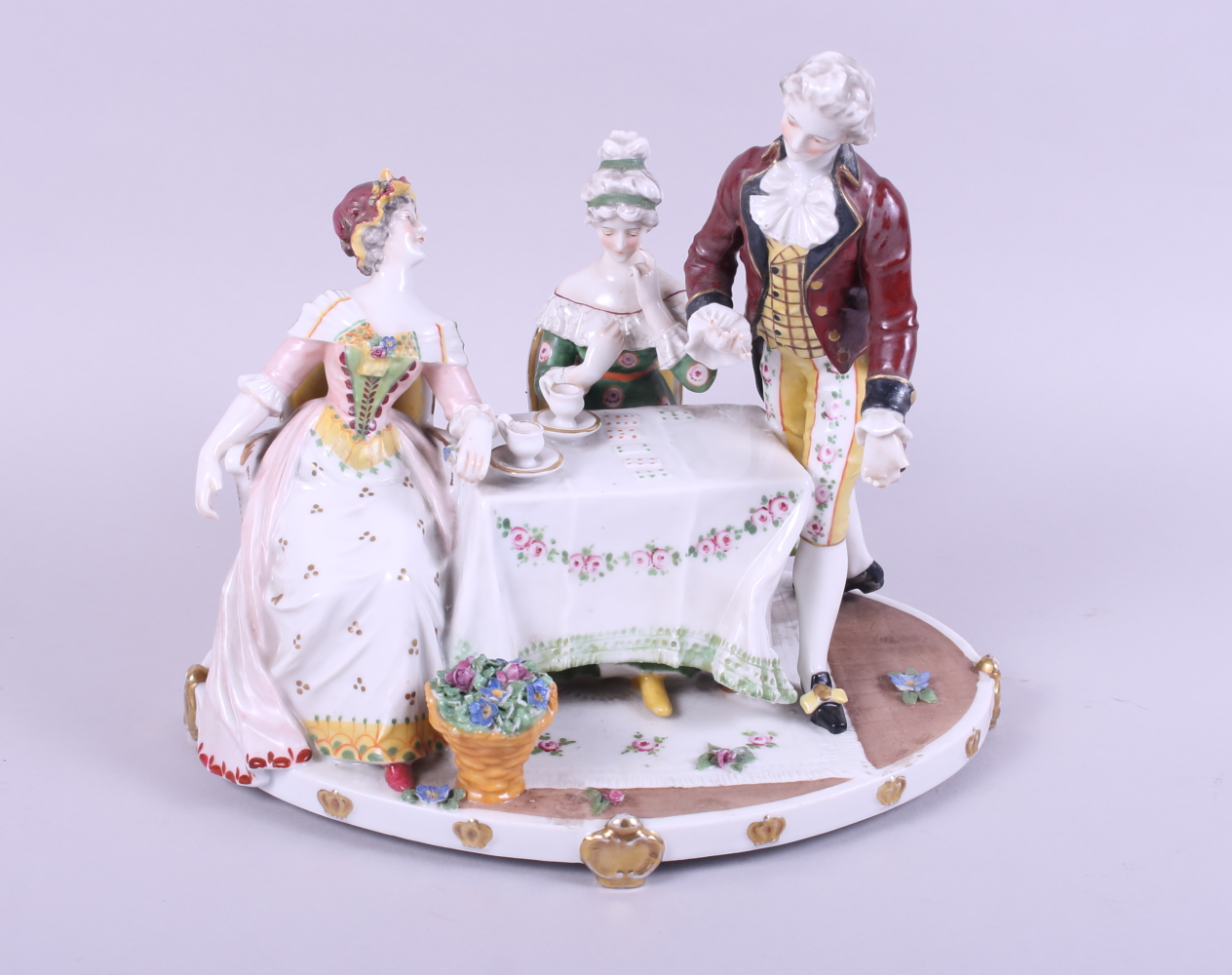 A Continental figure group, playing cards, 9" high (damages)