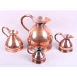 Four graduated copper measures