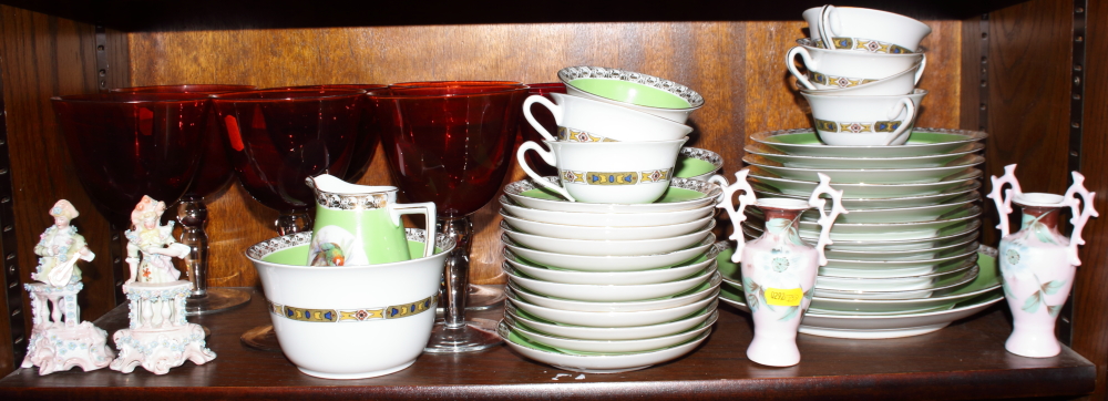 A Czechoslovakian part teaset, decorated with various birds, six cranberry goblets, two airtwist