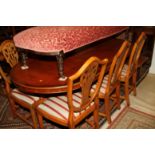 A double pedestal dining table, 59" x 39", and a set of six carved splat back dining chairs with