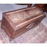 A panelled oak coffer of 17th century design, on stile supports, 41" wide