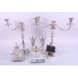 A pair of silver plated candelabra, a hipflask, two goblets, egg cups and spoons, a plated mustard