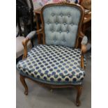 A pair of Louis XVI design polished as walnut framed armchairs with blue and white striped fabric