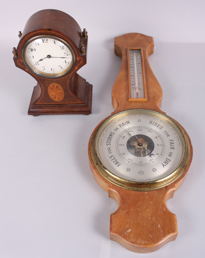 An Edwardian mahogany cased mantel clock with white painted dial and Arabic numerals, 8 1/4" high,