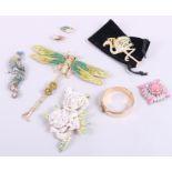 A rolled gold hinged bangle, a collection of vintage crystal set brooches and a pair of similar clip